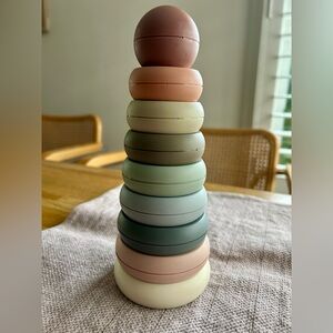 Mushie Stacking Rings Toy in earth tone colors